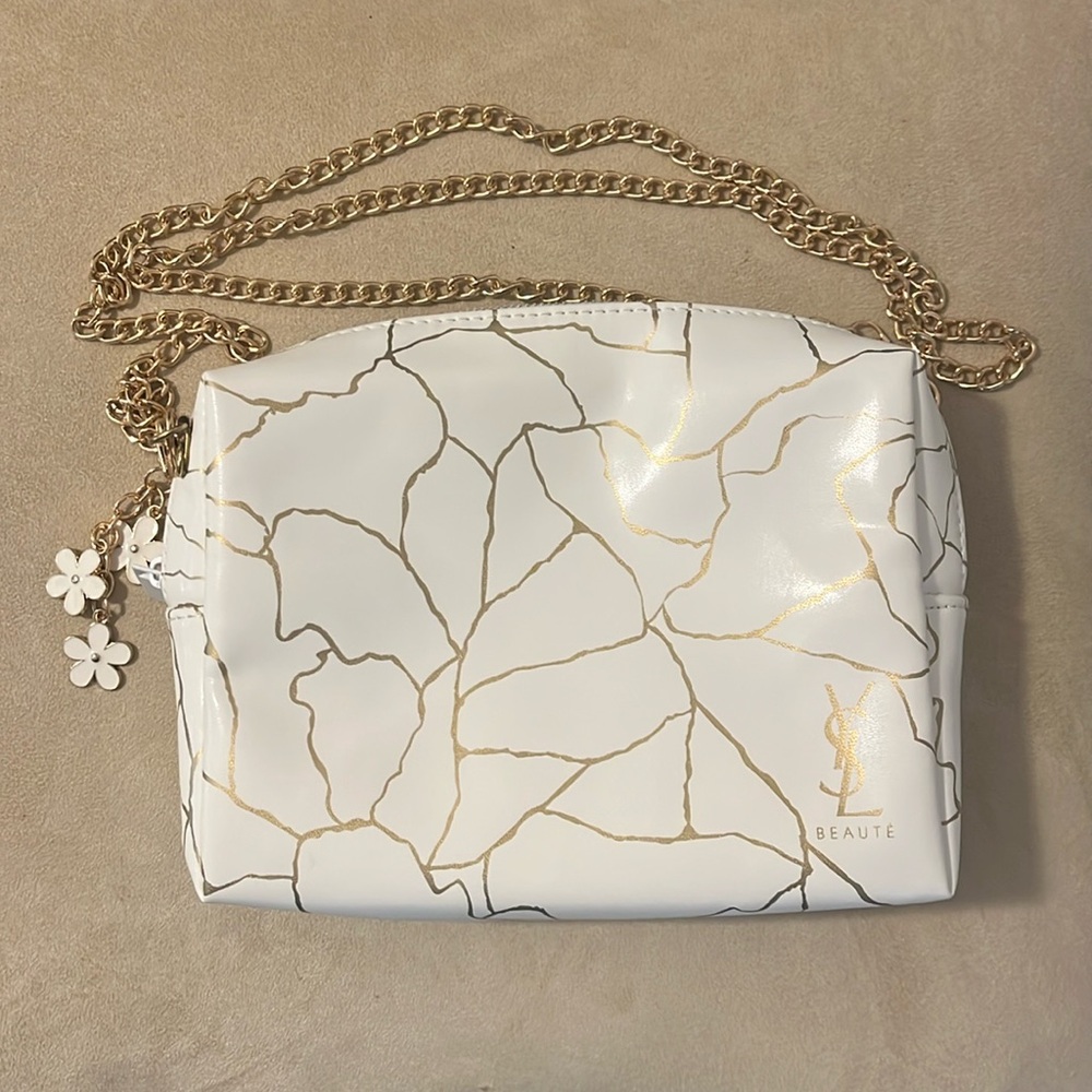 Yves Saint Laurent White and Gold Crossbody Bag
Super thick plastic